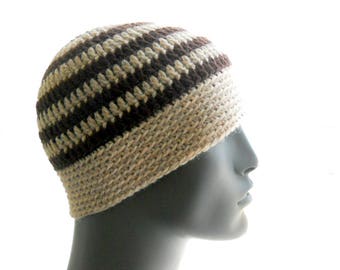 May include: A brown and beige striped crocheted beanie hat.