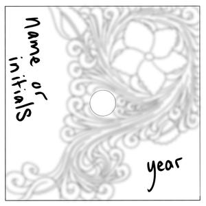 May include: White background featuring a blurred floral pattern and a central circle. The words "name or initials" are written vertically on the left, and the word "year" is written on the bottom right.