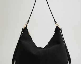 Bolso bandolera de piel auténtica negra: un moderno y elegante bolso de hombro para el día y la noche.