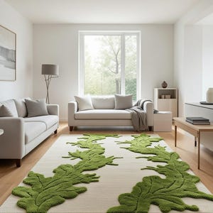 May include: A rectangular area rug featuring a cream-colored base with two prominent, raised, green, organic, leaf-like patterns that extend vertically across the surface, creating a textured, botanical-inspired design for floor coverage.