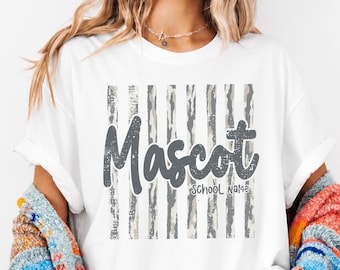 May include: A white short-sleeve t-shirt featuring a graphic design with vertical gray distressed stripes. The word Mascot is printed in a large dark gray script font, with the words SCHOOL NAME in a smaller font underneath the text.