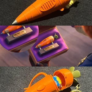 May include: An orange carrot-shaped container with a silver tip, green leaves, and a gold keychain. The container is open, revealing a blue and white candy. The text "OUR FIRST CASE" is on a small plaque.