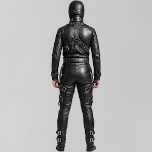 May include: A black leather outfit, including a jacket, pants, and hood. The jacket has a harness design, and the pants feature multiple straps with buckles. The outfit is designed with a sleek, form-fitting silhouette.