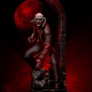 May include: A detailed statue of a vampire with a bald head, dark clothing, and a menacing expression. The figure is posed on a stone structure with skulls, set against a backdrop of a red moon and archway, creating a gothic horror theme.