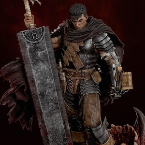 May include: A detailed collectible figurine of a warrior with short dark hair, wearing dark metal armor, a brown leather harness, and a tattered dark cloak. The figure holds a massive, weathered, rectangular metal sword and stands on a base.