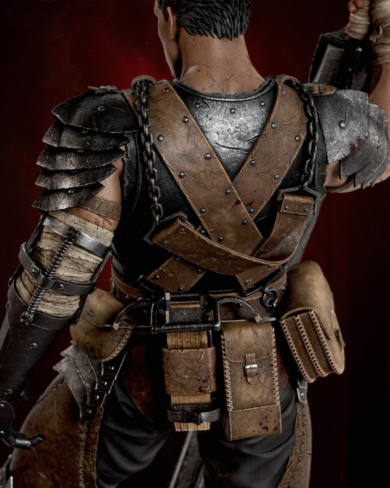 May include: A detailed action figure seen from the back, wearing dark metallic shoulder armor, a black chest plate with brown leather straps, and a belt equipped with multiple brown leather pouches and a small wooden block component.