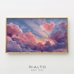 May include: A framed art print featuring a dreamy sky with pink and purple clouds, a heart-shaped cloud, and a golden frame. The text "RIALTO ART CO." is at the bottom.