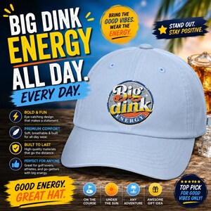 May include: Pale blue baseball cap with the words "Big Dink Energy" in a distressed design. The hat has a curved peak and an adjustable strap. The hat is designed for golf lovers, athletes, and go-getters.