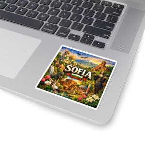 May include: A colorful sticker featuring the city of Sofia. The design includes landmarks, a lion statue, and the city's name in bold letters. The Bulgarian flag is also displayed. The sticker is placed on a laptop.