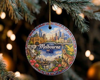 May include: A round ceramic ornament featuring a colourful illustration of the Melbourne city skyline, a koala in a tree, and two kangaroos. The text Melbourne and Australia are printed in the centre, accompanied by a small Australian flag icon.