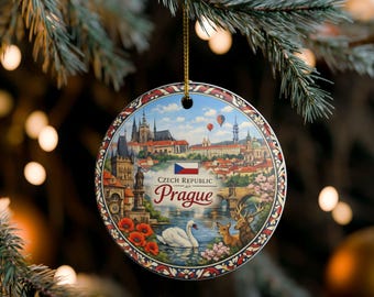 May include: A round ceramic ornament featuring a detailed illustration of the Prague skyline, the Czech Republic flag, and the text "CZECH REPUBLIC Prague". The scene includes a white swan, a deer, and red poppies, all framed by a decorative border.