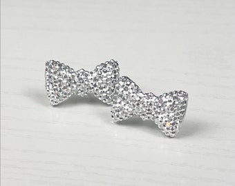 Sparkling Silver Acrylic Bow Earrings