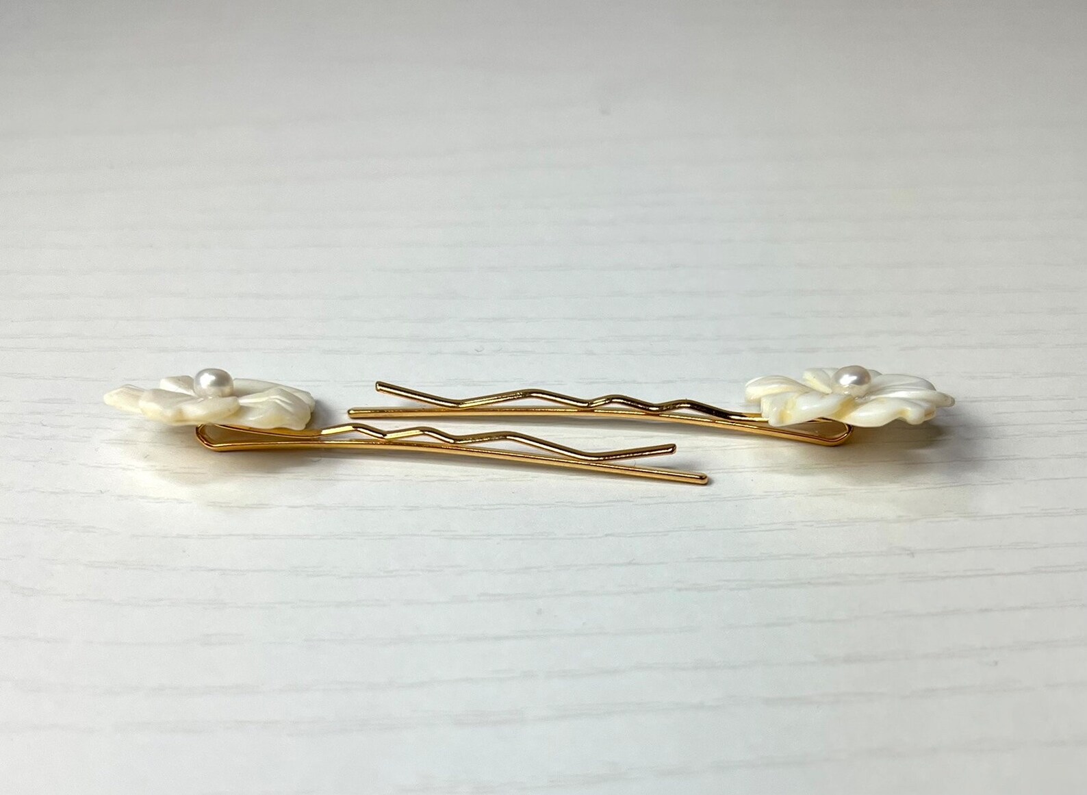 White Mother of Pearl and Cultured Pearl Plumeria Flowers on Gold Hair ...