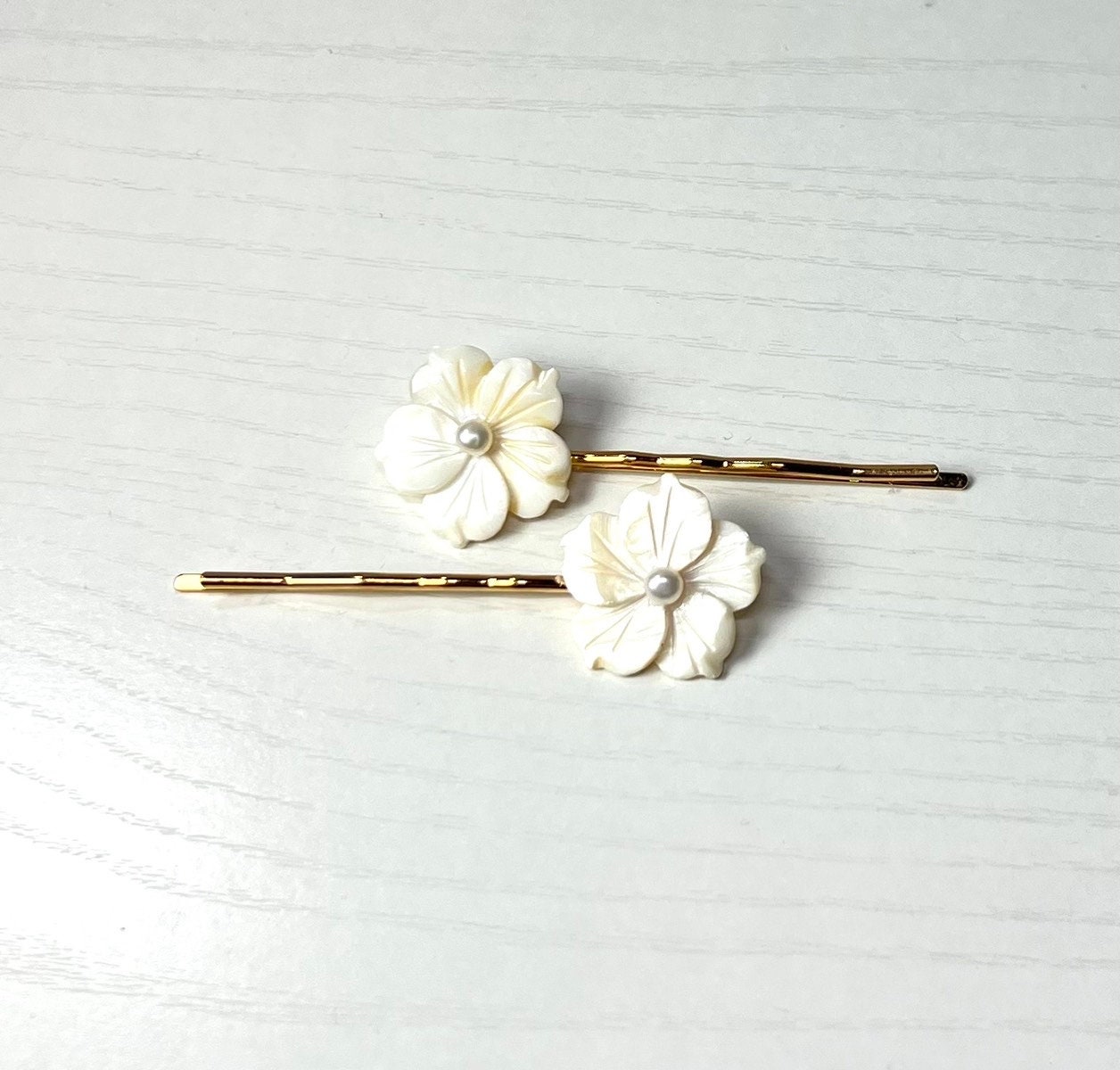 White Mother of Pearl and Cultured Pearl Plumeria Flowers on Gold Hair ...
