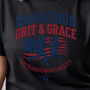 May include: Black t-shirt with the words "MARATHON GRIT & GRACE" in blue and red, along with a graphic of runners and an American flag design. The text "EXTRAORDINARY ABILITY" is below the graphic.