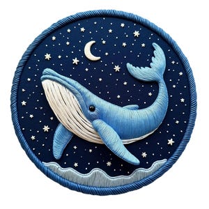 May include: A round, navy blue embroidered artwork featuring a blue whale swimming under a starry night sky. The whale has white accents and is surrounded by a crescent moon and embroidered stars. The border is a thick, twisted rope design.