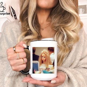 May include: A set of three ceramic mugs with a speckled, matte finish. The mugs are in shades of cream, light gray, and dark gray. Each mug has a simple, minimalist design, perfect for coffee or tea.