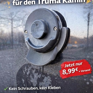 Può includere: Una presa d'aria magnetica grigio scuro per un camino Truma, con il marchio "Truma" e la parola "HOT" visibili. Il testo "Magnetischer Ablauf für den Truma Kamin" è in alto. La presa d'aria è progettata per una facile installazione e rimozione.