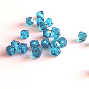 4mm Zircon bicone beads (x24)