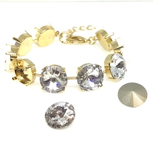May include: Gold bracelet with clear crystal stones. The bracelet is made of metal and has a clasp closure. The stones are round and have a faceted design. The bracelet is shown with an extra crystal stone.
