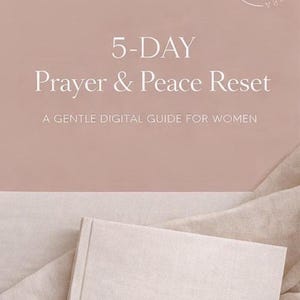 May include: A soft pink digital guide titled "5-DAY Prayer & Peace Reset" with white text. The guide is for women and features the "HV" logo. A matching book with the "HV" logo is in the foreground, resting on a beige fabric.