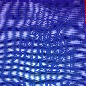 May include: Blue crocheted blanket with a white design of a tree and the word "Peace" at the bottom.