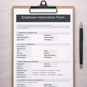 May include: A clipboard with an "Employee Information Form" for HR and new hires. The form includes sections for personal, contact, and employment information, as well as emergency contacts. A black pen rests on the right side of the clipboard.