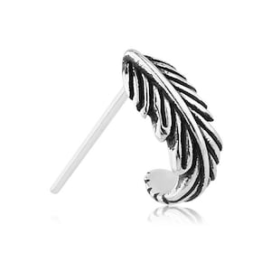 May include: A silver feather nose ring with a detailed design. The ring is made of surgical steel and is perfect for those who want a unique and stylish look.