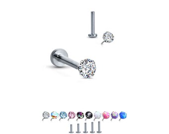 May include: A set of 10 stainless steel body jewelry pieces with a clear gem. The gems are available in a variety of colors, including clear, blue, pink, and opal.