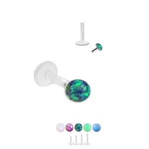 May include: A clear plastic body piercing with a small, round, iridescent opal gemstone. The gemstone is available in a variety of colors, including white, pink, purple, green, blue, and light blue.