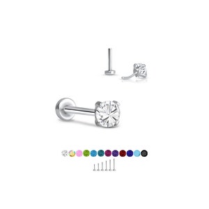 Puede incluir: Un labret de plata con una gema de circonita cúbica transparente y de corte redondo. Debajo, se muestran tachuelas con varias gemas de colores, junto con diferentes longitudes de poste. La joya está diseñada para piercings en labios u orejas.