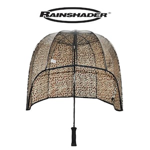 May include: A clear umbrella with a leopard print canopy. The umbrella has a black handle and frame. The brand name "RAINSHADER" is printed at the top.