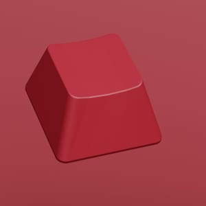 May include: A red keycap with the word "Cherry" in white text at the top. The keycap is a solid, square shape with a slightly angled top. The background is a matching red color.