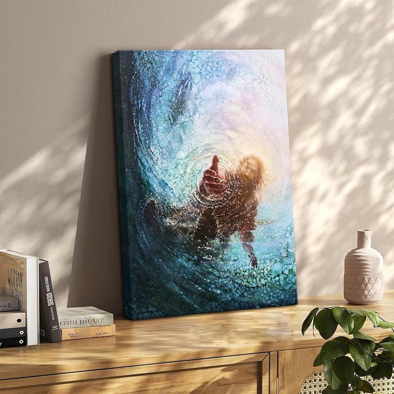 May include: Canvas art print showing a person reaching out from swirling blue water. The artwork uses blues, greens, and yellow, creating a dynamic, textured effect. The person's hand is outstretched, suggesting a theme of hope or rescue. The canvas is 60 cm x 40 cm.