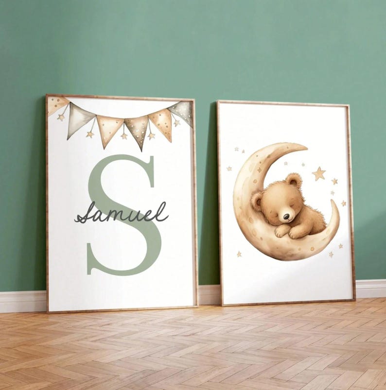 May include: Two framed nursery art prints. One features a large green letter "S" with the name "Samuel" in script, and a banner of pennants. The other shows a sleeping teddy bear on a crescent moon with stars.