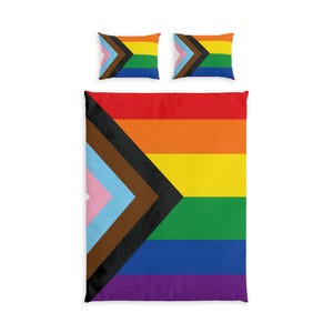 May include: A bedding set consisting of a large rectangular duvet cover and two matching rectangular pillowcases. The design features the Progress Pride flag with horizontal red, orange, yellow, green, blue, and purple stripes and a chevron.