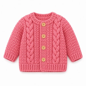 May include: A bright pink long-sleeve cardigan featuring a textured cable knit pattern on the front panels, a ribbed crew neckline, ribbed cuffs, and a ribbed hem. The garment is fastened with four light brown wooden buttons down the centre front.
