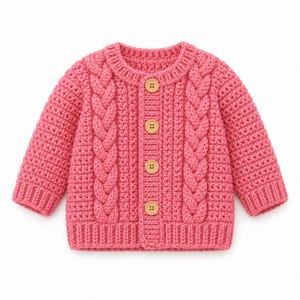 May include: A bright pink long-sleeve cardigan featuring a textured cable knit pattern on the front panels, a ribbed crew neckline, ribbed cuffs, and a ribbed hem. The garment is fastened with four light brown wooden buttons down the centre front.
