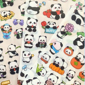 May include: Sheets of panda bear stickers in various poses, holding flowers, fruit, and signs. The stickers are black, white, and pastel colors. Some stickers have the word "HAPPY" on them.