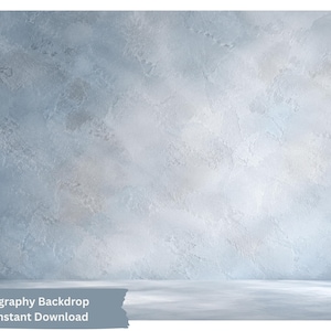 May include: A digital photography backdrop featuring a textured, light blue and white plaster-like surface. The image displays a wall and floor transition with soft, mottled color variations and subtle light patterns across the entire scene.