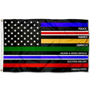 May include: Black American flag with white stars and stripes, featuring colored stripes representing various service members. The flag includes blue for police, red for firefighters, and green for military.