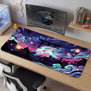 May include: A rectangular desk mat featuring a vibrant illustration of a white fox leaping across a Japanese-style landscape under a starry sky. The design incorporates pink, purple, and teal hues, with traditional lanterns and architectural elements. The text "REAPER DESK MAT" is visible.