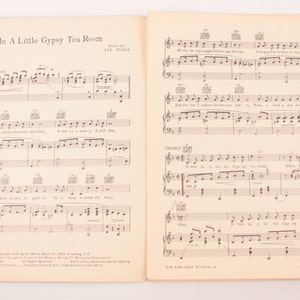 May include: A vintage sheet music score for the song "In A Little Gypsy Tea Room" by Edgar Leslie and Joe Burke. The sheet music features the lyrics and musical notation for the song.
