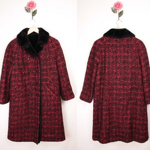 May include: A long red and black tweed coat with a black faux fur collar. The coat has a double breasted closure and two pockets.