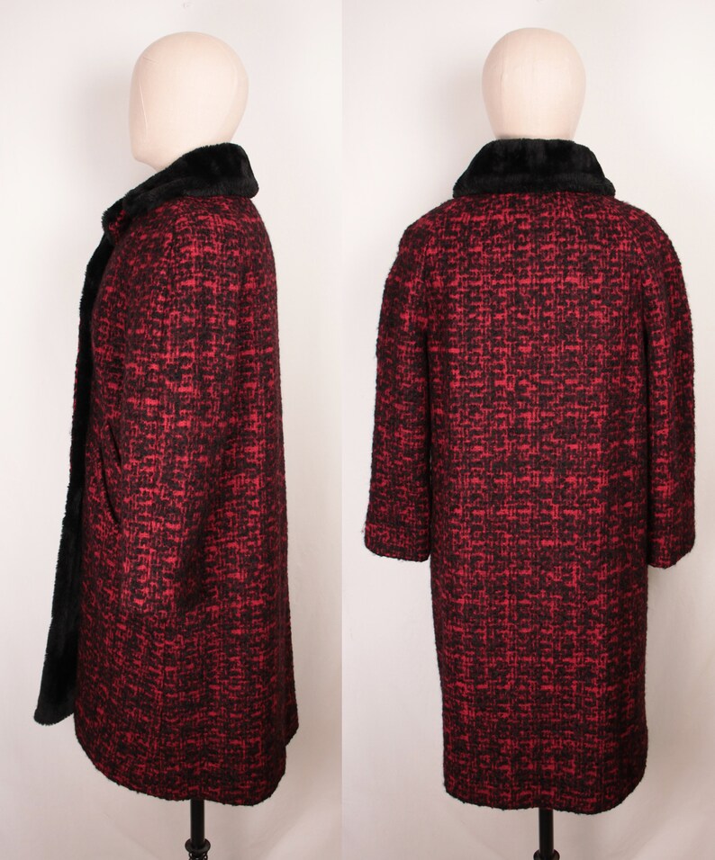 May include: A red and black tweed coat with a black faux fur collar. The coat is long and has a fitted silhouette.