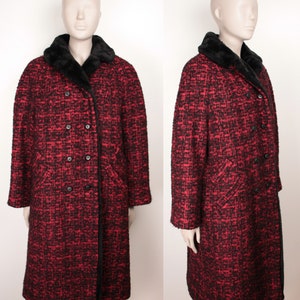 May include: A long red and black tweed coat with a black faux fur collar. The coat has a double breasted closure with black buttons.