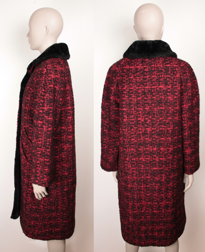 May include: A long red and black tweed coat with a black faux fur collar. The coat has a button closure and long sleeves.