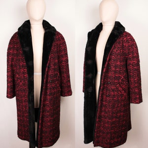 May include: A long red and black tweed coat with a black faux fur collar and lining. The coat has a double breasted closure and two pockets.