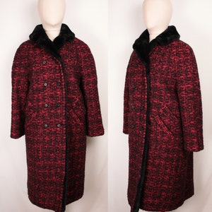 May include: A long red and black tweed coat with a black faux fur collar. The coat has a double breasted closure and two pockets.
