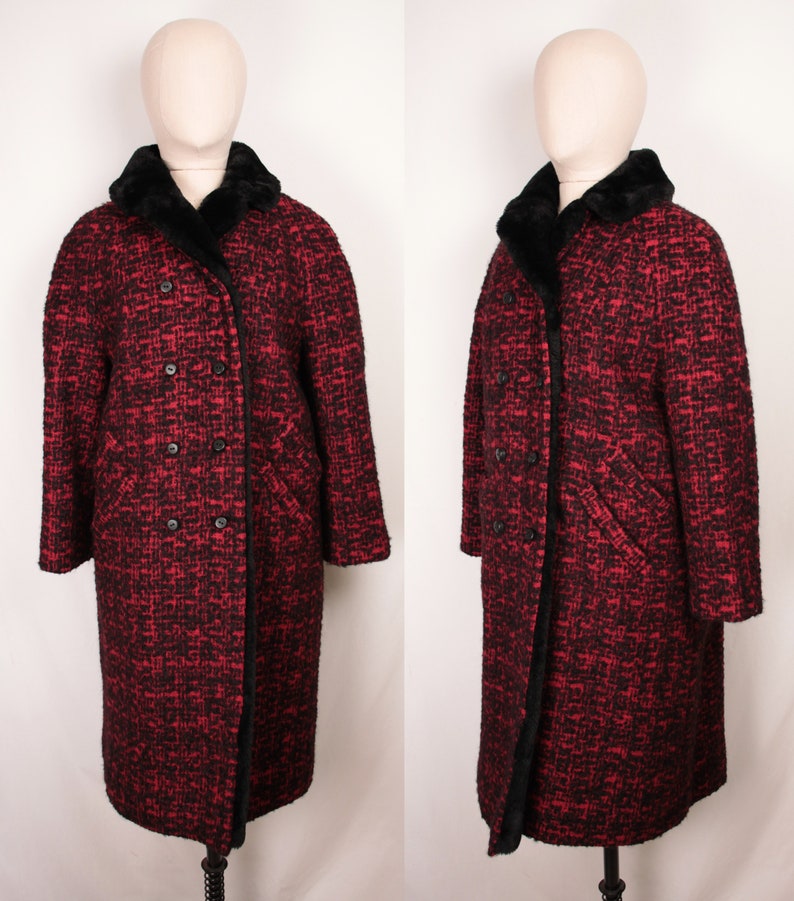 May include: A long red and black tweed coat with a black faux fur collar. The coat has a double breasted closure and two pockets.